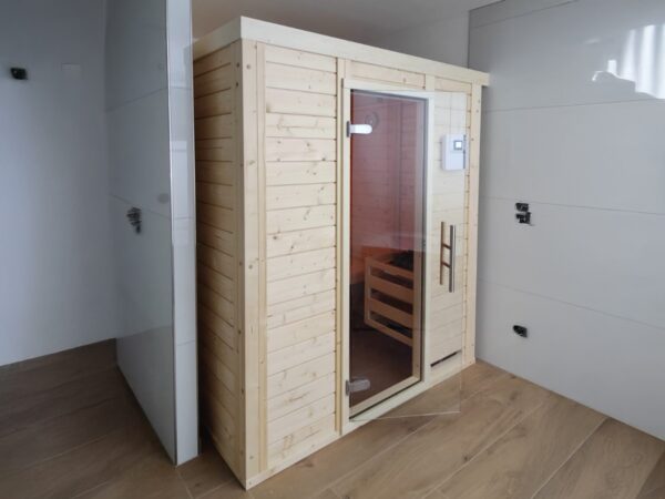 premium innensauna daniel massivholz, innensauna kaufen deutschland, blockbohlen sauna 45 mm, heimsauna polarfichte innenraum, sauna mit glastür innenbereich, massivholz sauna wohnraum
